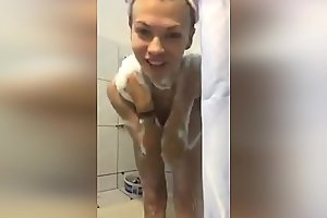 A girl from Russia takes a camera phone in the bathroom